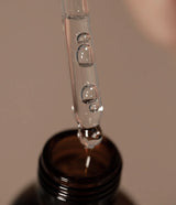 Oway Comforting Scalp Oil dispensed from the glass dropper