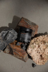 Oway Water Resin hair pomade jar styled with volcanic rock