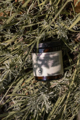 Oway RebuildM+ Hair Mask jar photographed among lavender plants