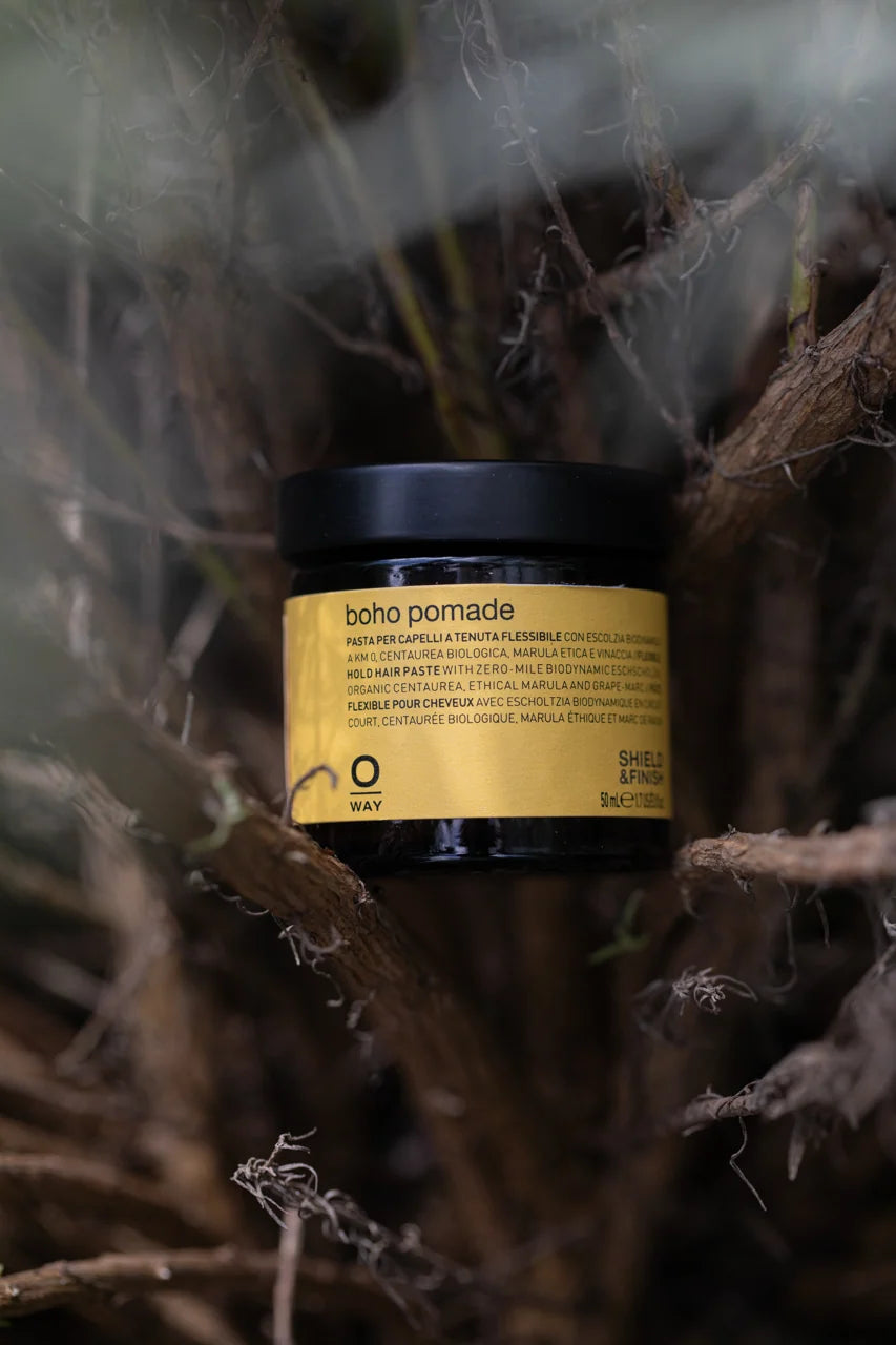 Oway Boho Pomade 50ml amber glass jar among woodland botanicals