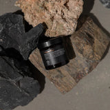 Oway Bungee Fiber jar resting among textured stones