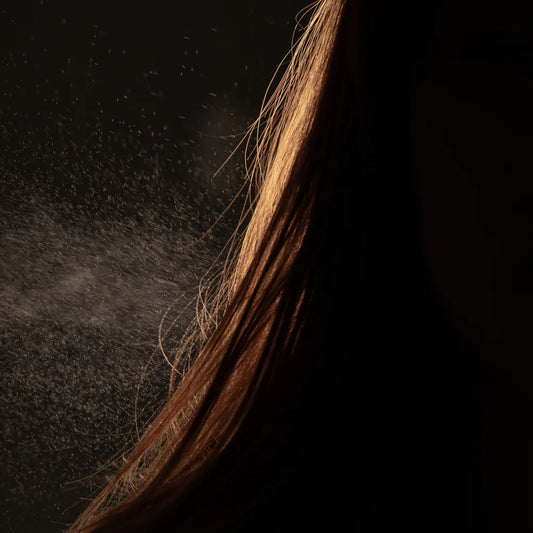 Oway Molding Mist 240ml sprayed as a fine mist onto brown hair