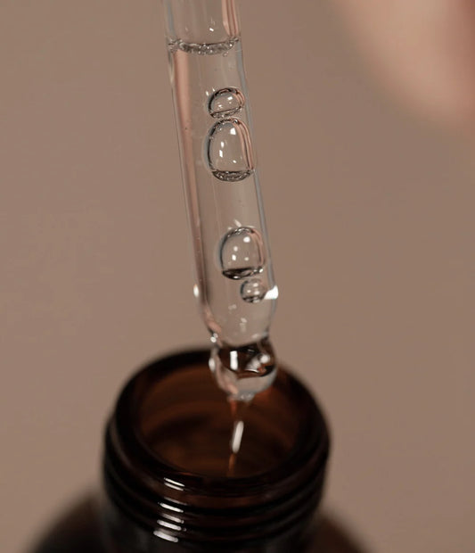 Oway Comforting Scalp Oil dispensed from the glass dropper