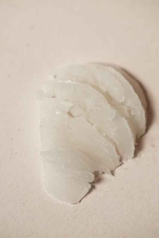 Close-up of the rich, creamy texture of Oway Precious Wax hair wax
