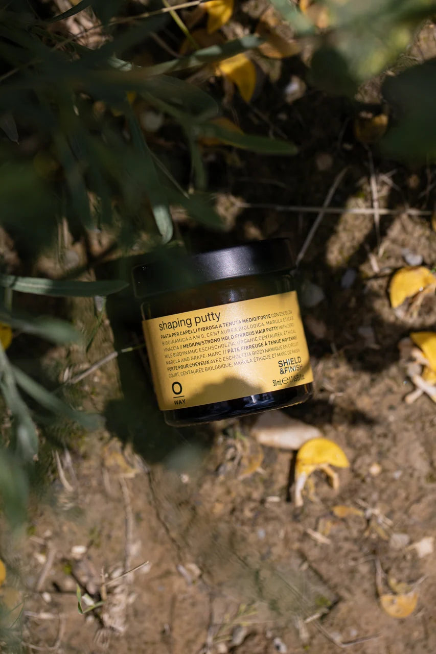 Oway Shaping Putty 50ml amber glass jar among natural botanicals