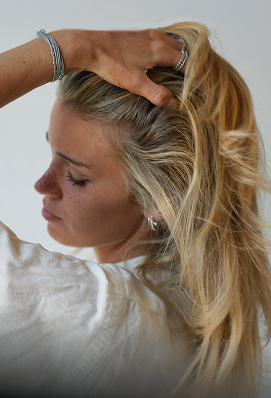 Why blonde hair turns brassy after summer & how to prevent it