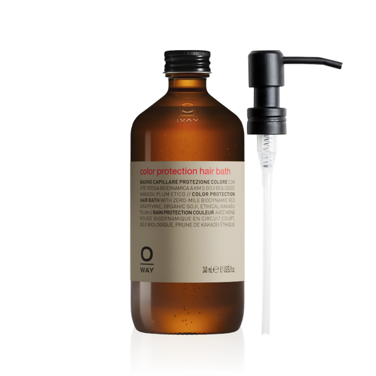 Oway Color Protection Hair Bath 240ml in an amber glass bottle with a black screw cap with metal pump dispenser