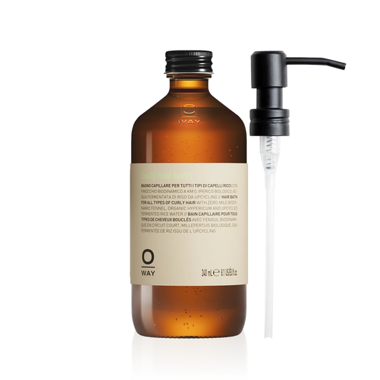 Oway Curly Hair Bath 240ml in an amber glass bottle with a black screw cap and metal pump despenser