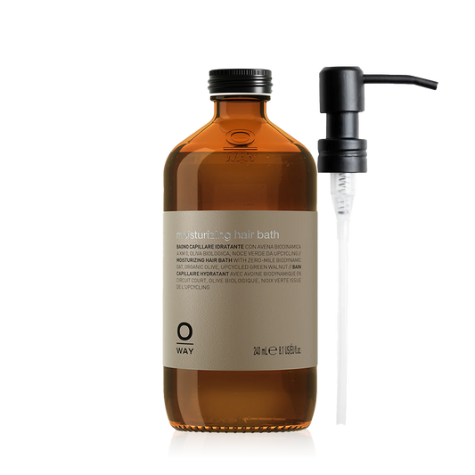 Oway Moisturising Hair Bath 240ml amber glass bottle with a black screw cap with metal pump despenser