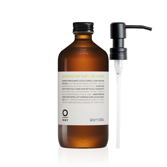 Oway Purifying Hair Bath for oily scalps in an amber glass bottle with metal dispenser