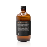 Oway Invigorating Hair & Body Wash 240ml amber glass bottle with a black label and screw cap